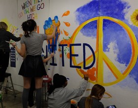 Students paint over racist graffiti found in art facility