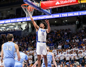 Justin Champagnie leads Pitt in scoring and rebounding as a freshman