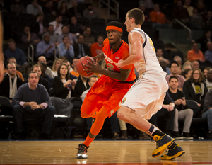 Syracuse's B.J. Johnson drives baseline in the No. 23 Orange's 73-59 loss to California on Thursday night. 