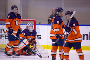 Syracuse players look on in disappointment after falling in the CHA title game again. 