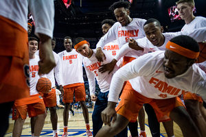 Syracuse huddles pregame.