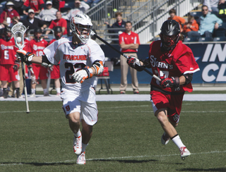 JoJo Marasco runs past St. John's defender John Bello.