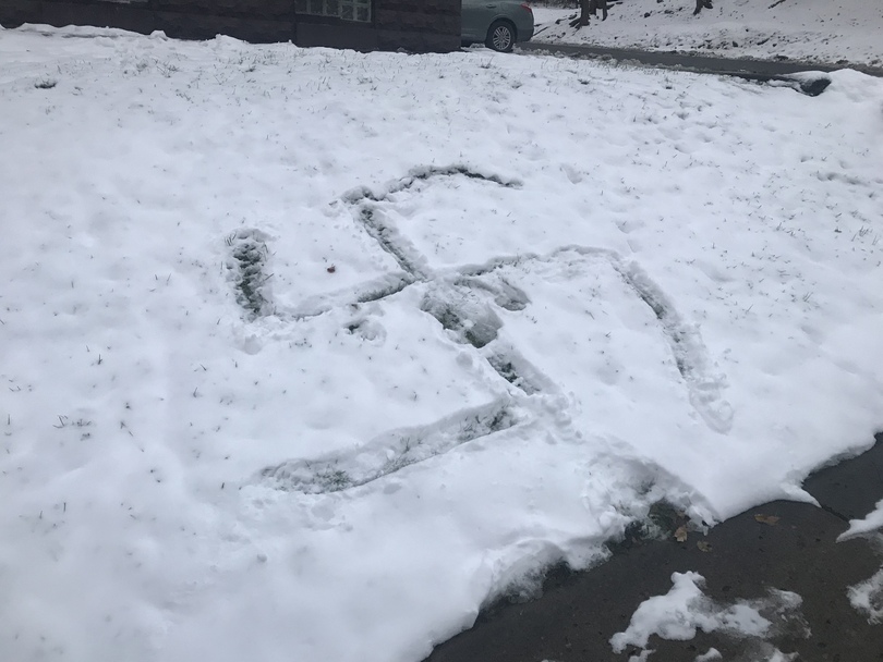 Swastika drawn in snow across from 505 on Walnut