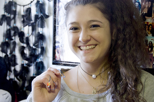 Neali Rogers designs and sells college themed chokers. She was searching for a trendy way to complete her tailgating outfit and decided to make her own choker.   