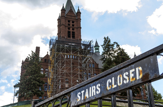 Scaffolding remains along the front of Crouse College as crews work on masonry restoration. Photo taken by July 11, 2017